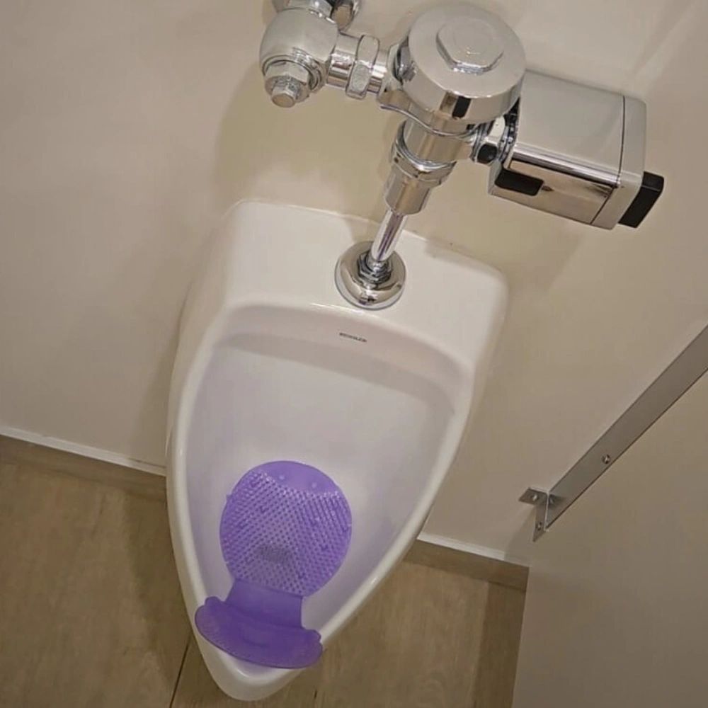 U-R-IN® lavender circular patented urinal screen with drip-catching splash prevention design